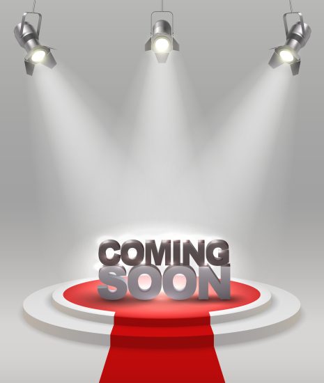 Coming soon colored composition on stage with red carpet that spotlights illuminate vector illustration